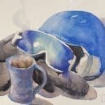 Watercolor painting of ski helmet, goggles and gloves with a cup of hot chocolate.